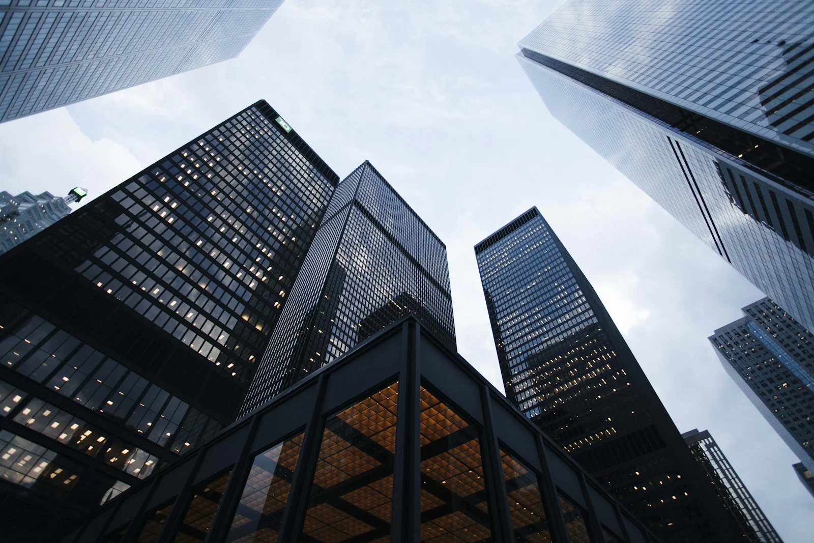 Looking up at glass-clad commercial high-rise towers