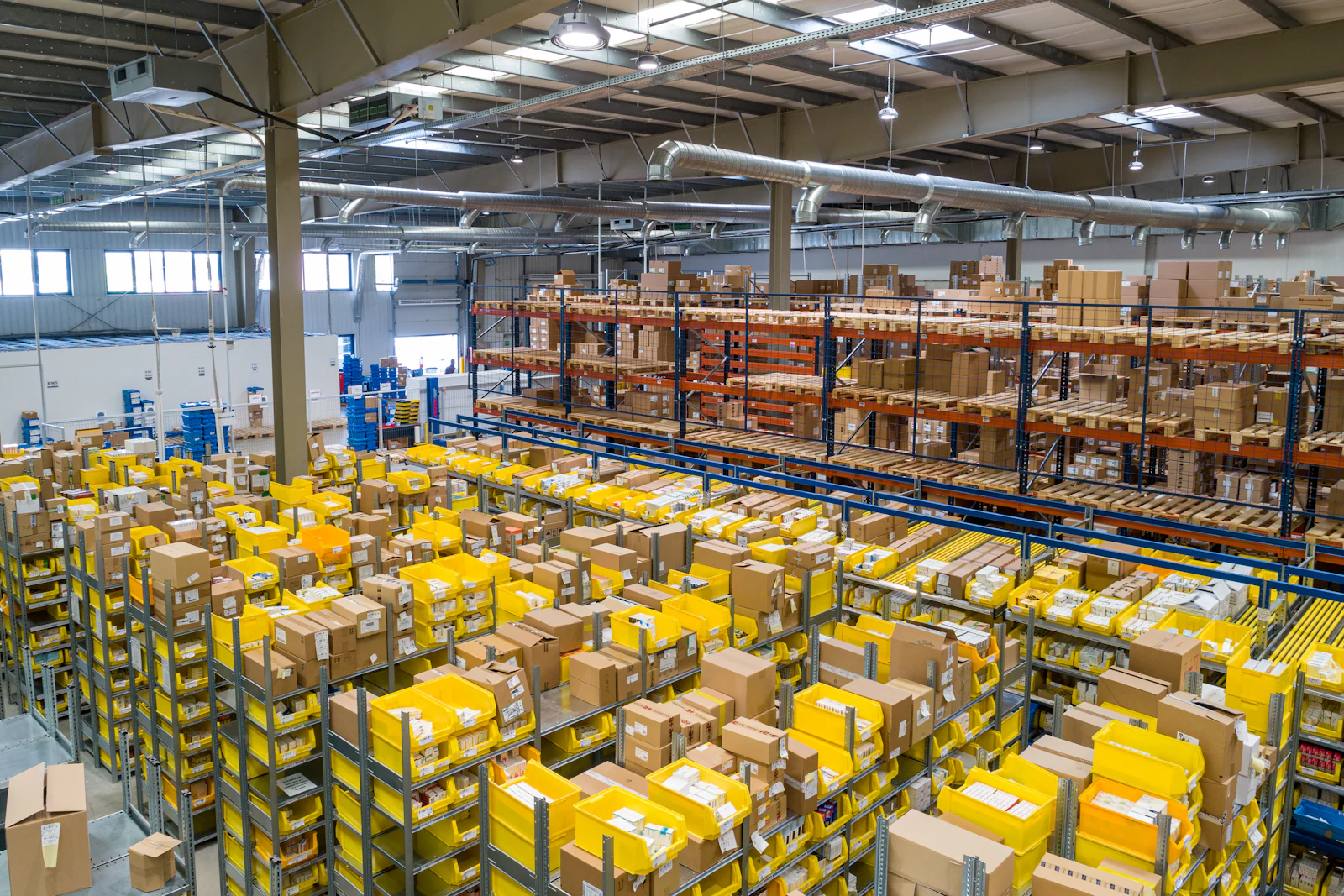 Large warehouse interior with steel racking and stored goods